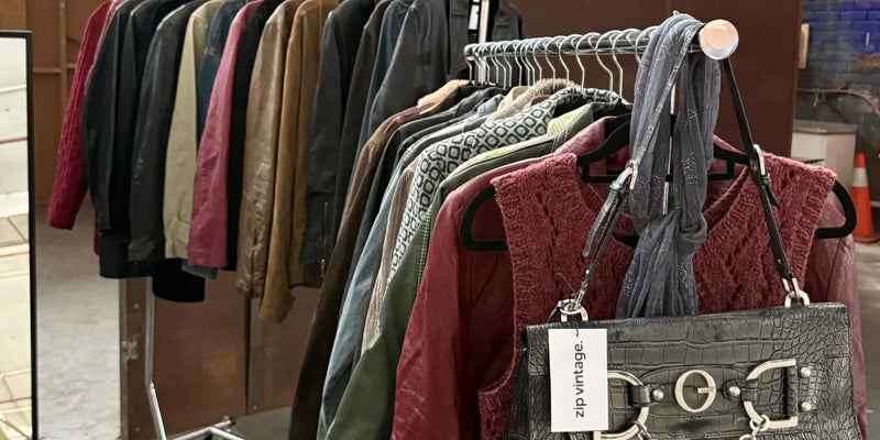 Vintage scarf hanging on a rack of clothes