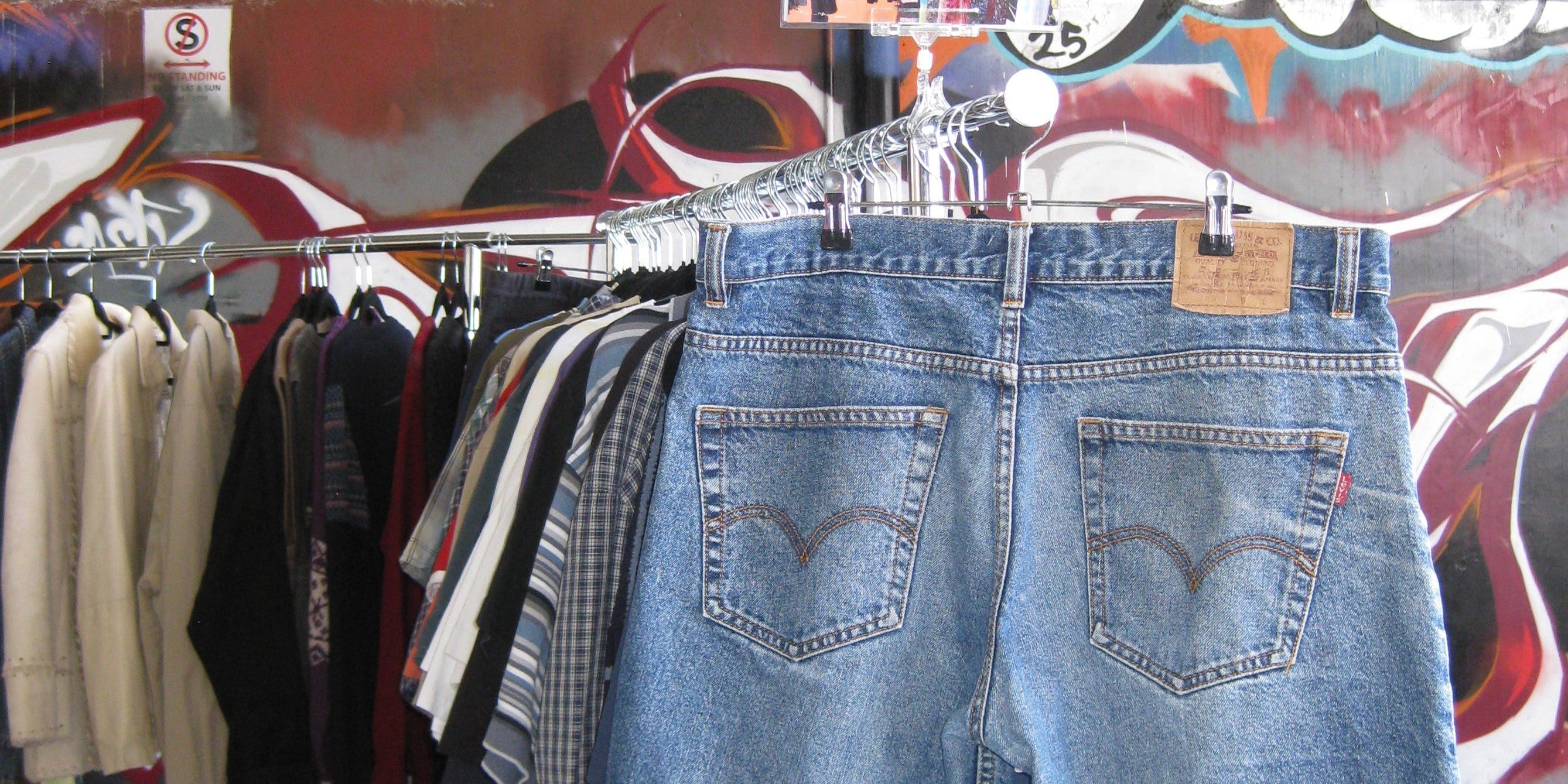 Pair of vintage jorts on a rack