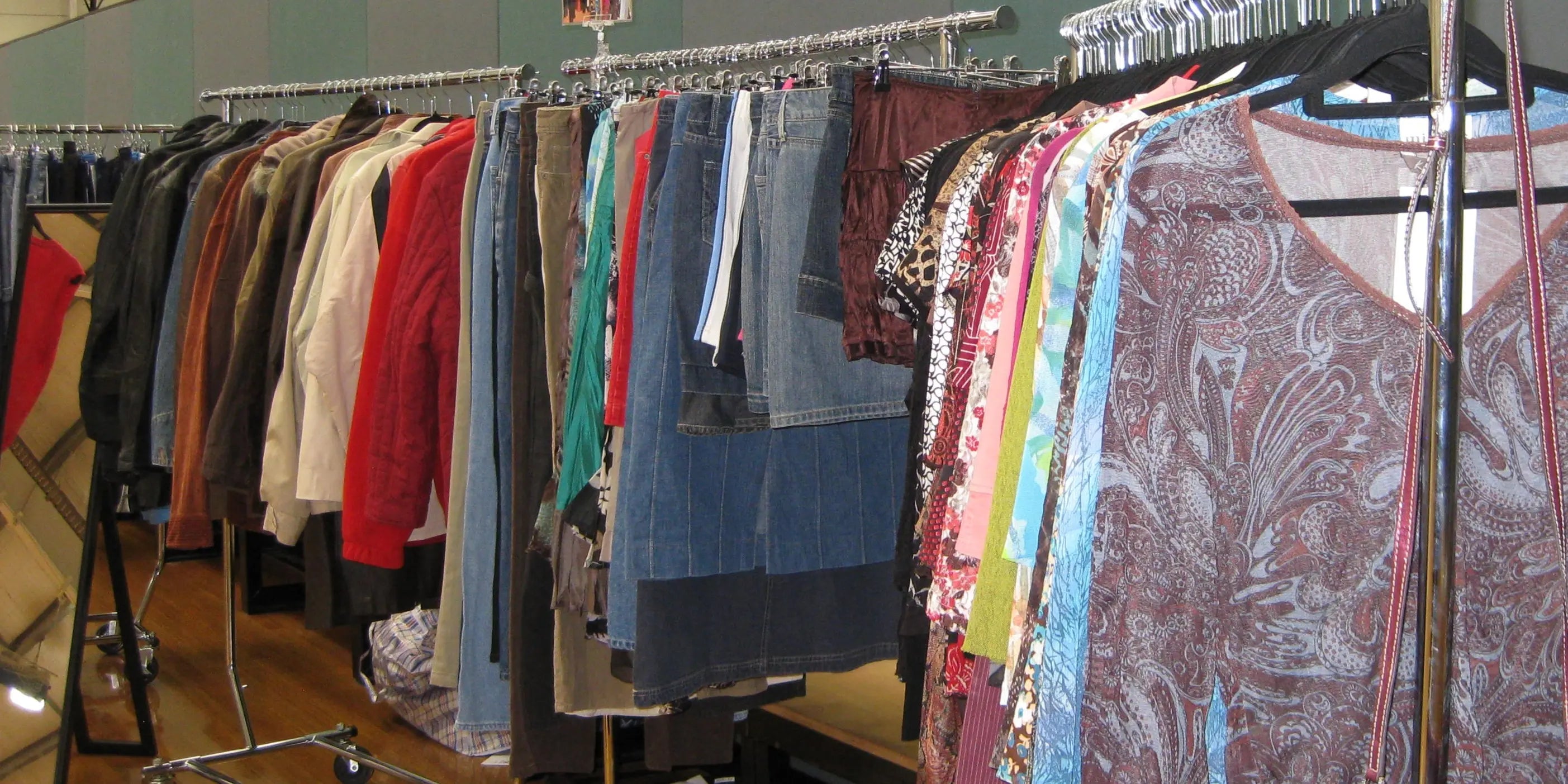 Vintage midi skirts on a rack with other racks beside it