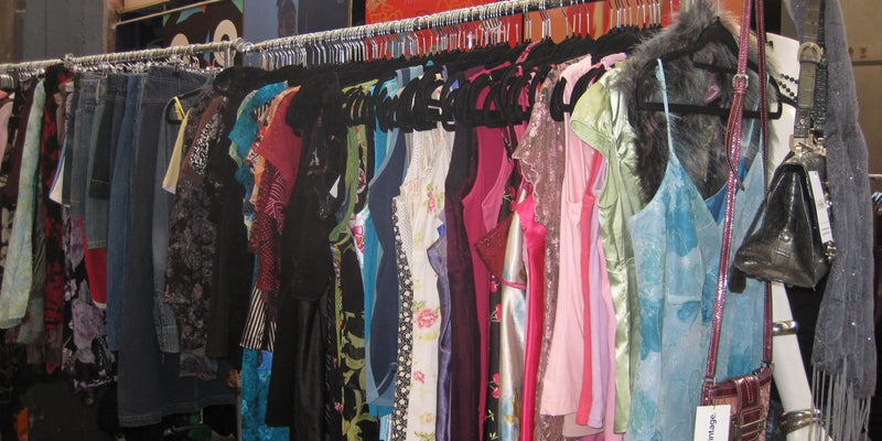 Vintage slip dresses hanging on a rack
