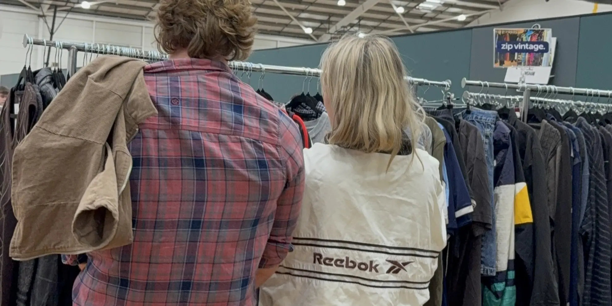 A vintage windbreaker on a customer and on the racks