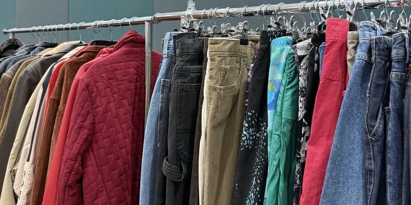 A rack of vintage clothing including some vintage shorts