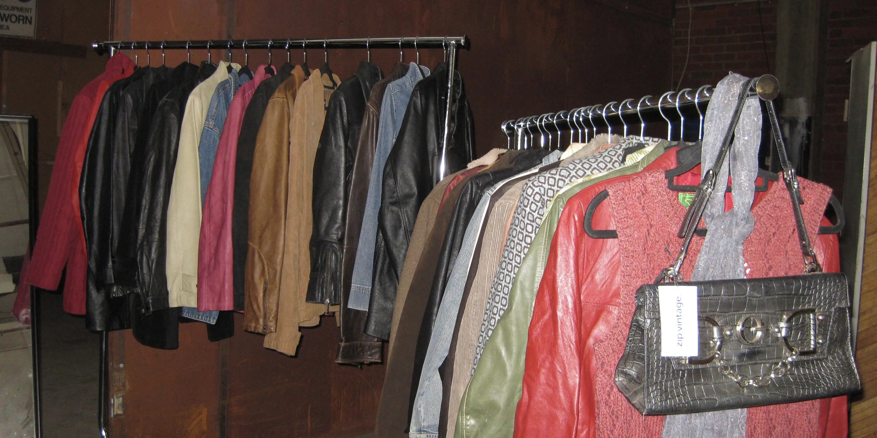 A rack of vintage jackets with a vintage corduroy jacket