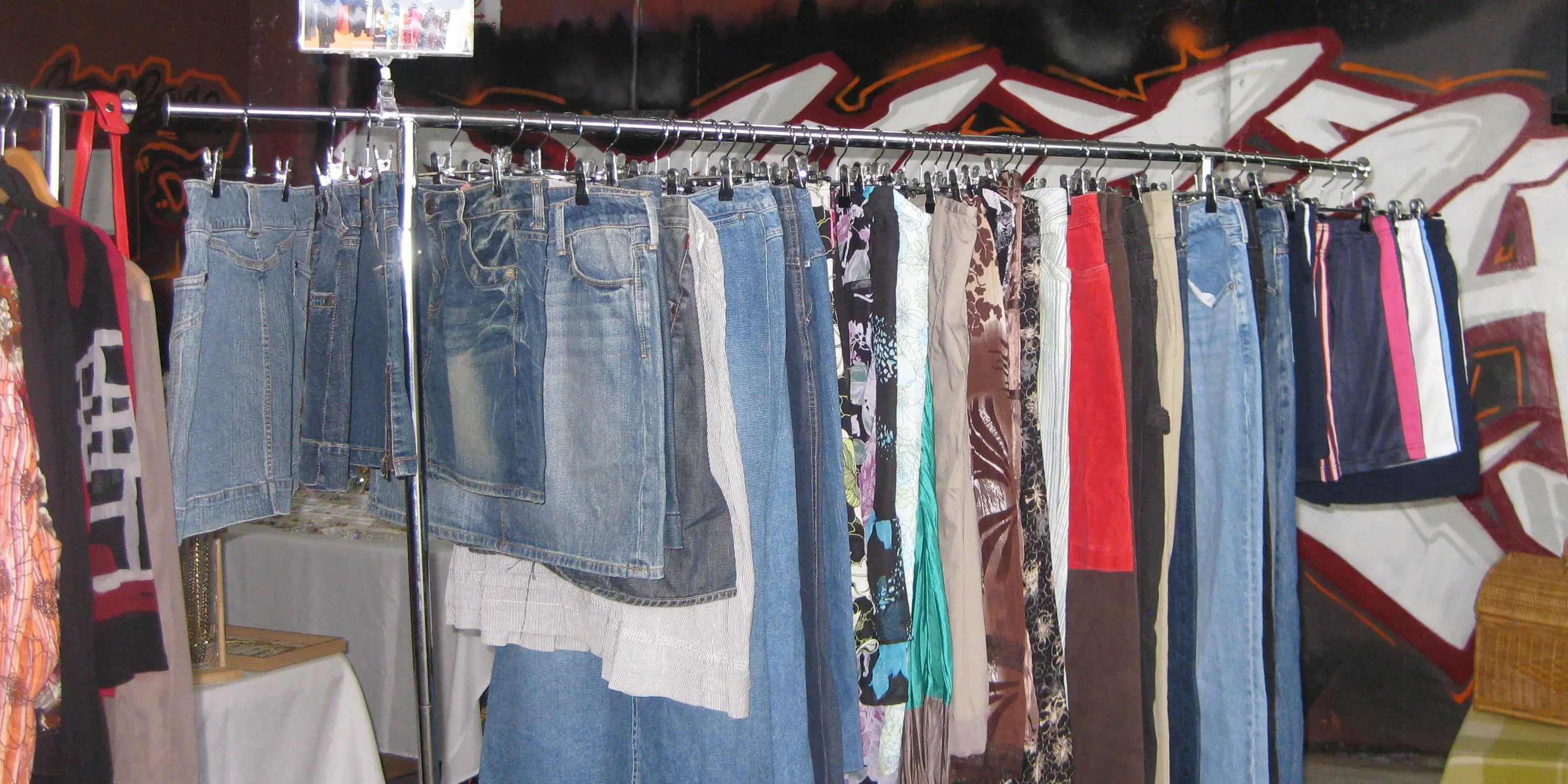 Rack of vintage jeans and skirts