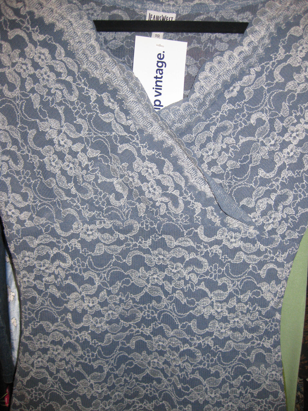 Wrap-style lace top in blue, size 10