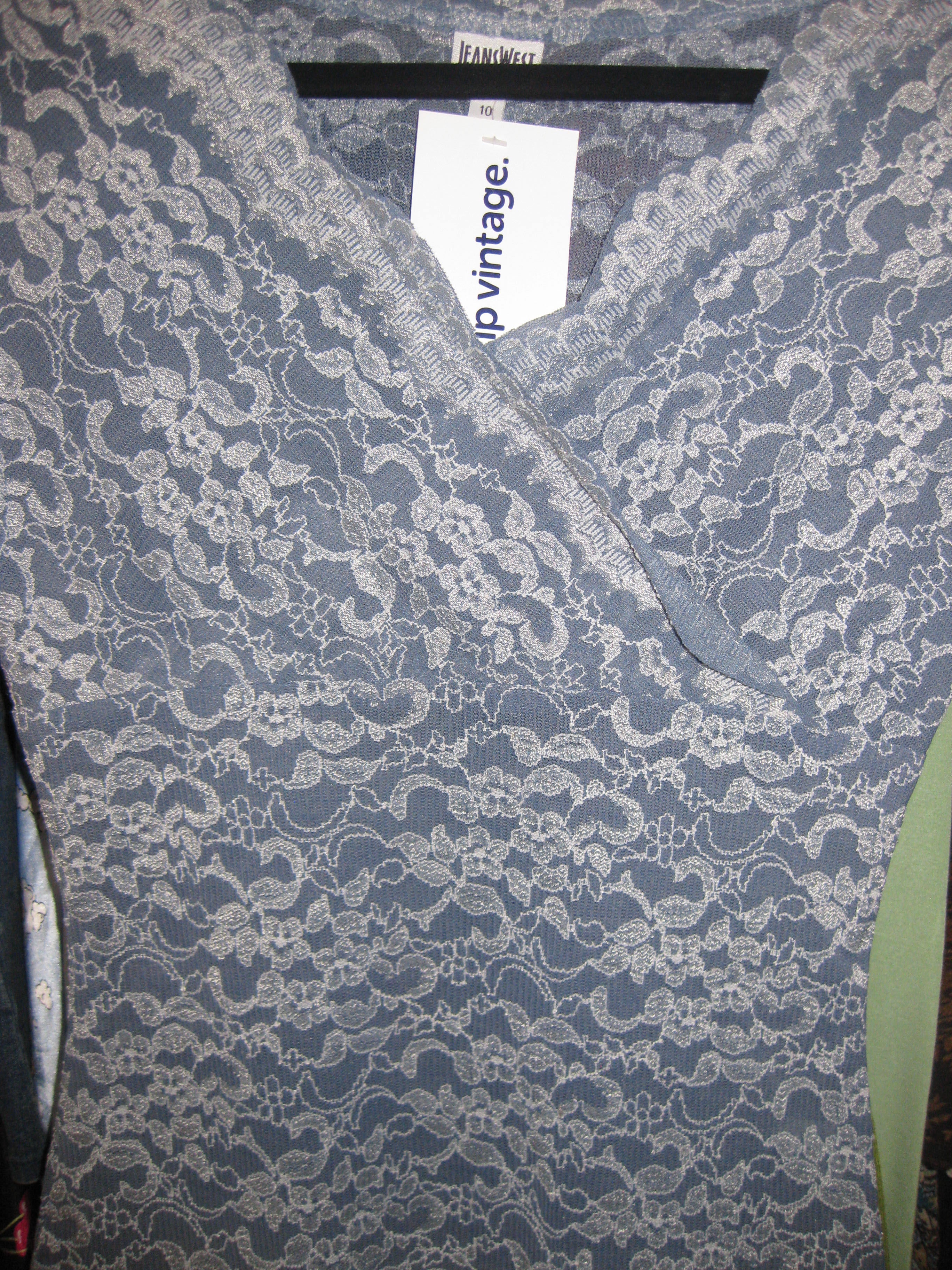 Wrap-style lace top in blue, size 10