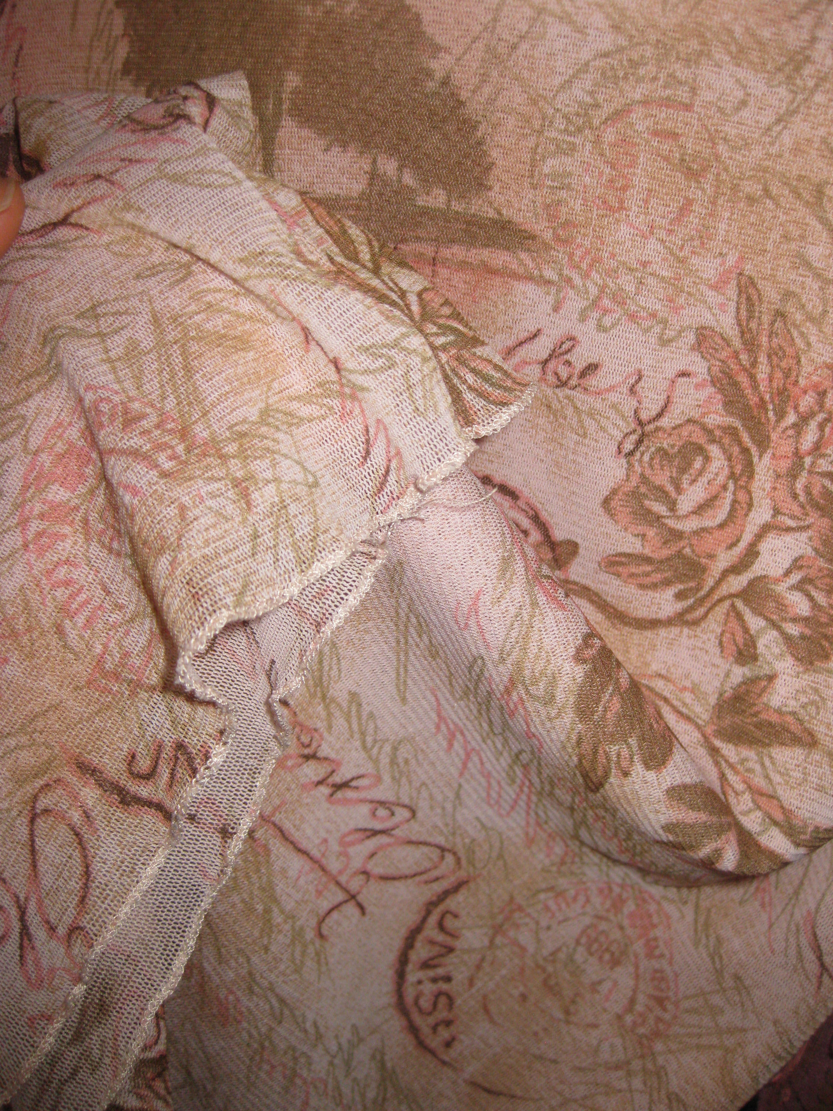 Pink top with mesh fabric and graphic design